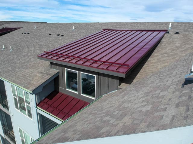 close-up of new shingle and metal roof