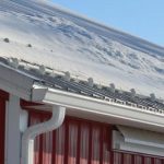 a metal roof with snow on it
