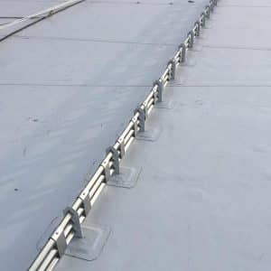 a snow fence installed onto pvc roof