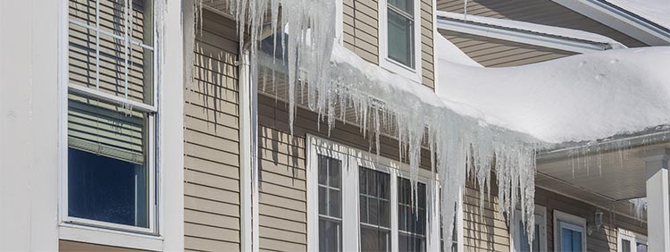ice dams on roof of house